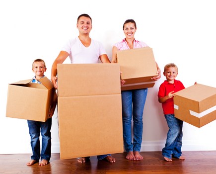 Man and van removals team loading furniture in Mitcham