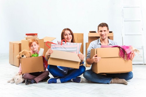 Removal van and moving team in a Mitcham residential street