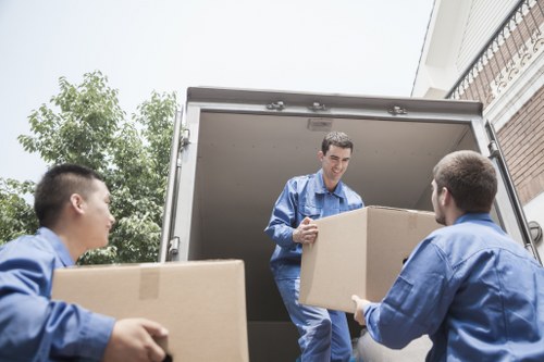 Local mover handling furniture on a residential street in Mitcham