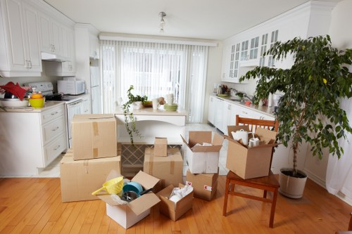 Packed boxes and home moving equipment ready for a Mitcham relocation