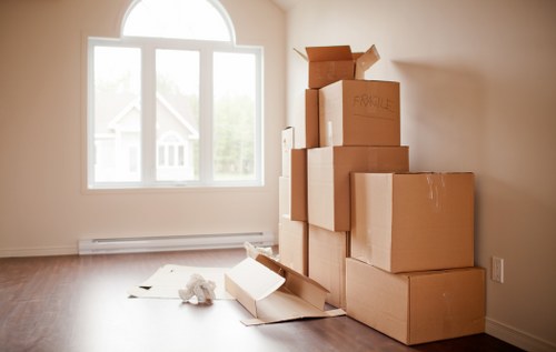 Professional movers loading boxes and furniture into a van