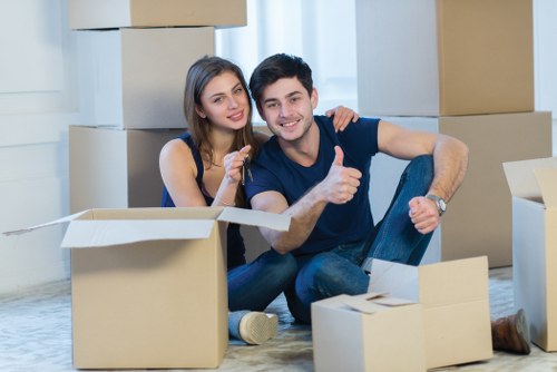 Furniture and boxes being loaded into a removal van