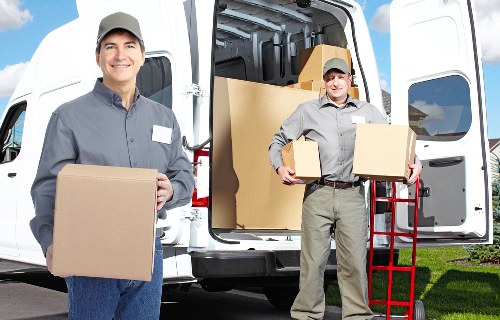 Professional movers handling furniture for a Mitcham house move